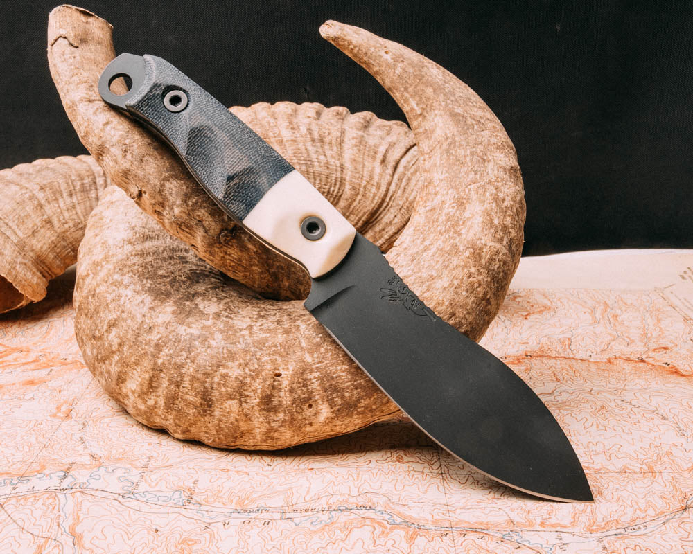 Hunter Skinner- Camel bone, black canvas micarta, sniper grey cerakote, allen bolts, grooved grip