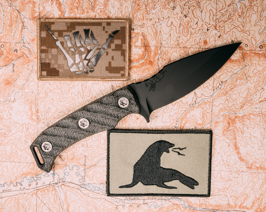 Ishi- black canvas micarta, Armor Black cerakote, titanium torx bolts, iron grip