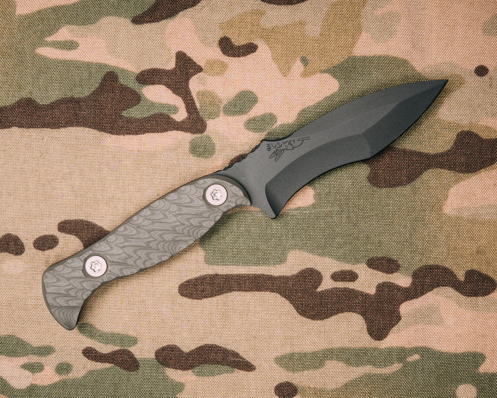 Extremis MK1- Charcoal Grey G10 with ruby G10 liner, Sniper grey cerakote, Ti allen bolts, hollow lanyard hole, iron grip